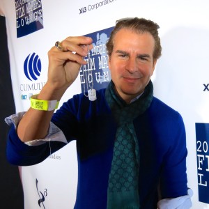 Actor Producer Vincent De Paul receives Hero Goody Necklace at Sundance 2014.