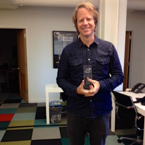 Joel Bach accepts Golden Goody Award at Years of Living Dangerously office in NYC.