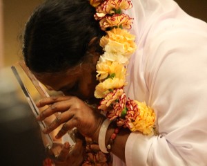 Amma ("The Hugging Saint") accepts Golden Goody Award from the Goody Awards before embracing thousands at the Los Angeles International Airport Hilton